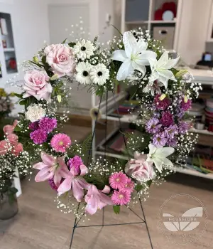 Elegant Pink & White Heart-Shaped Sympathy Wreath. Fresh flower bouquets in Toronto